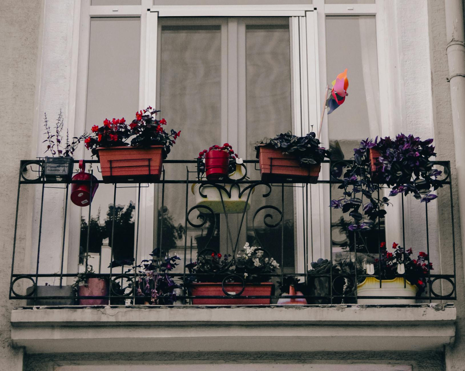 A picturesque balcony in Istanbul adorned with colorful potted plants, adding a touch of nature. on Urban Sprout Corner